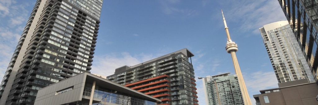 Image of buildings in downtown Toronto with the CN Tower in the background.